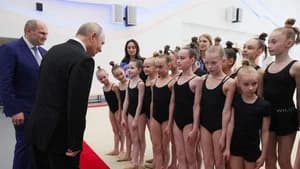 Why is Putin posing with children?